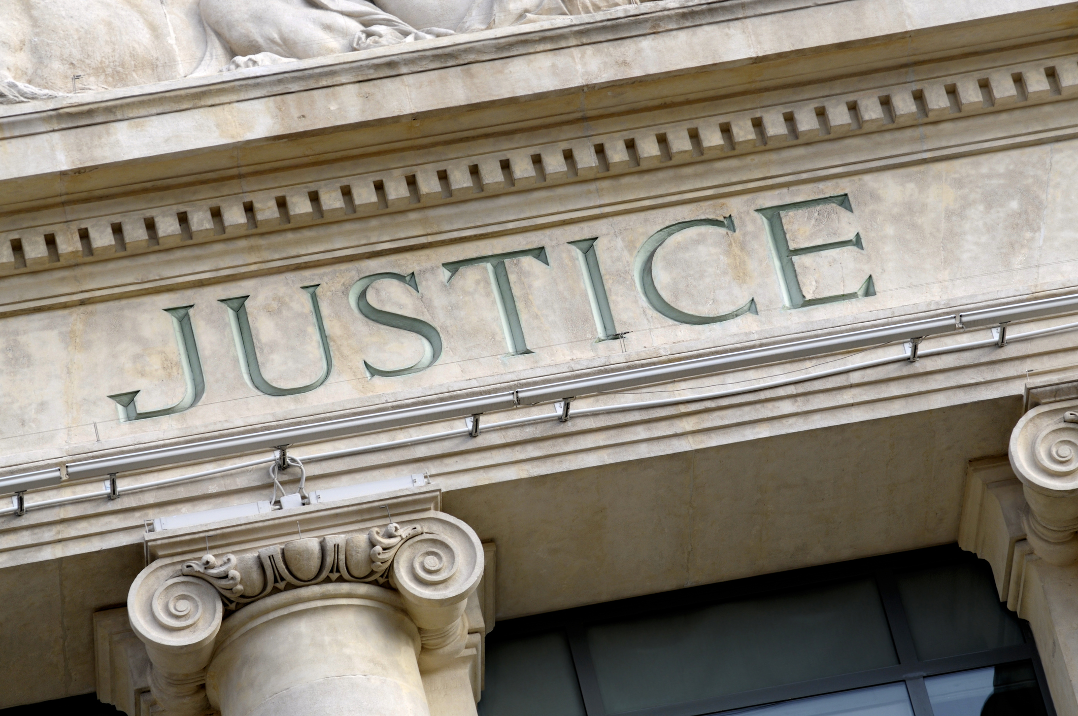 Justice sign on a Law Courts building.  New high resolution version shown below: